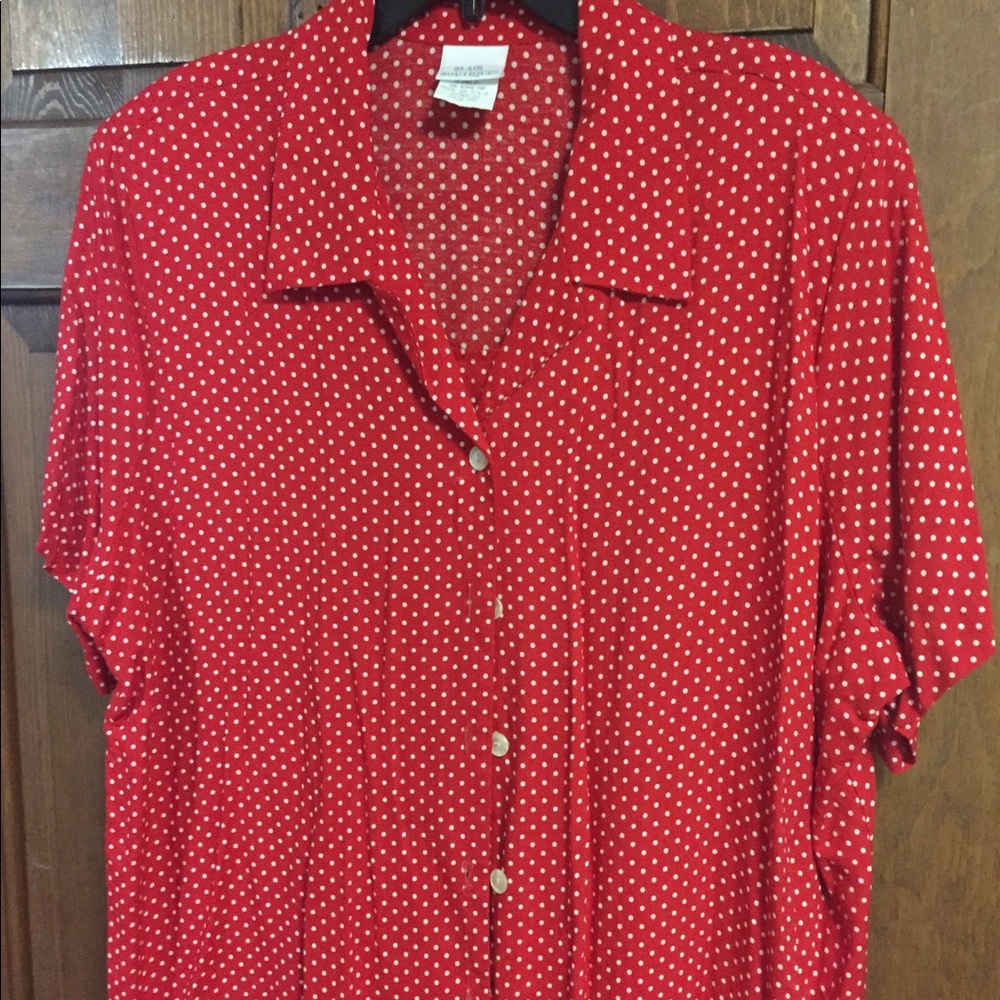Button up collared shirt with short sleeves.